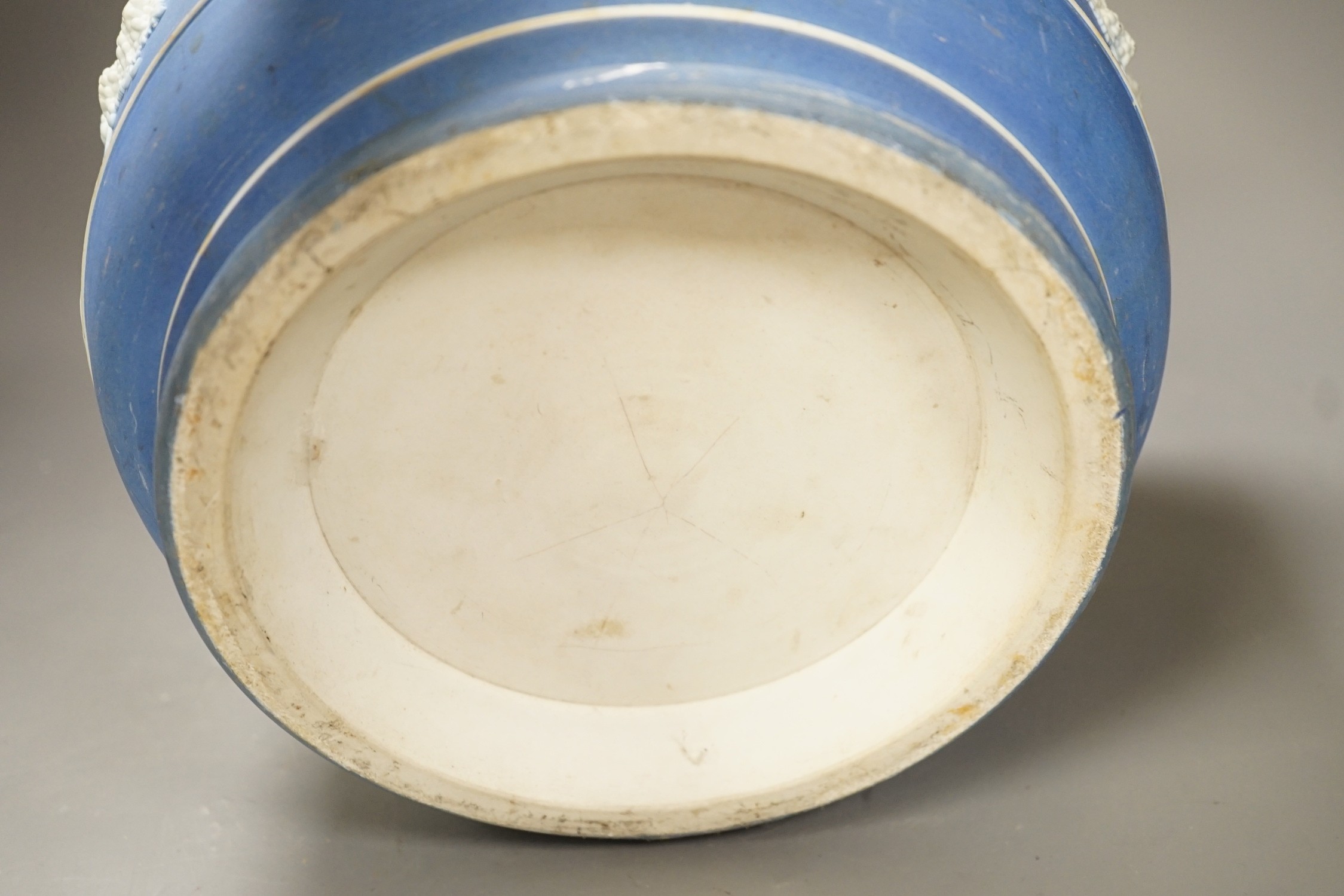A Wedgwood blue jasper jardiniere, sprigged with muses and swags, height 23cm